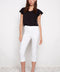 Model wearing UP! Techno Core Capri Pant in White, front view.