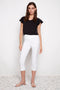 Model wearing UP! Techno Core Capri Pant in White, front view.