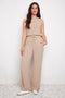 Model wearing UP! Air Flow Wide Leg Pant in Cashew, front view.