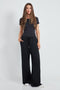 Woman wearing the Butter Wide Leg Pant in Black.