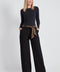 Woman wearing the Ponte Tie-Sash Wide Leg Pant in Black.