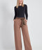 Woman wearing the Ponte Tie-Sash Wide Leg Pant in Biscuit.