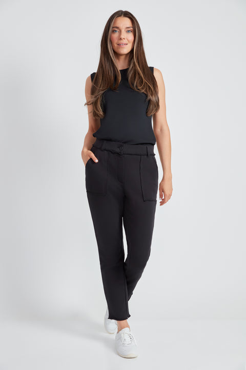 Woman wearing the French Terry Raw Edge Slim Cargo Pant in Black.