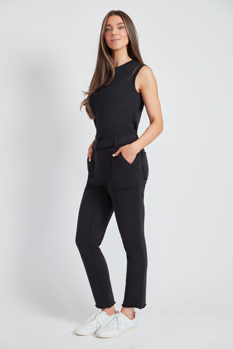 Woman wearing the French Terry Raw Edge Slim Cargo Pant in Black, side view.