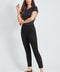 Woman wearing the Suede Petal-Vent Slim Pant in Black.