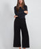 Woman wearing the Ponte Belted Gaucho Pant in Black.