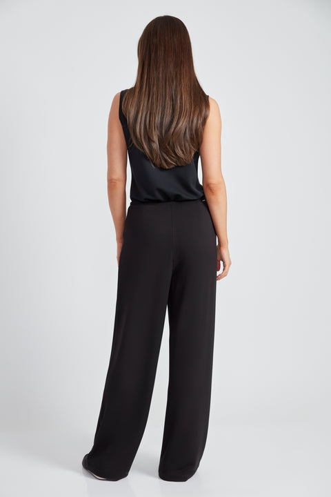 Woman wearing the Provence Wide-Leg Pant in Black, side view.