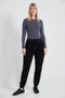Woman wearing the Knit Corduroy Jogger in Black.