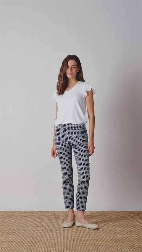 Video of model wearing UP! Coastal Techno Button-Vent Ankle Pant in Coastal print with button vent detail.